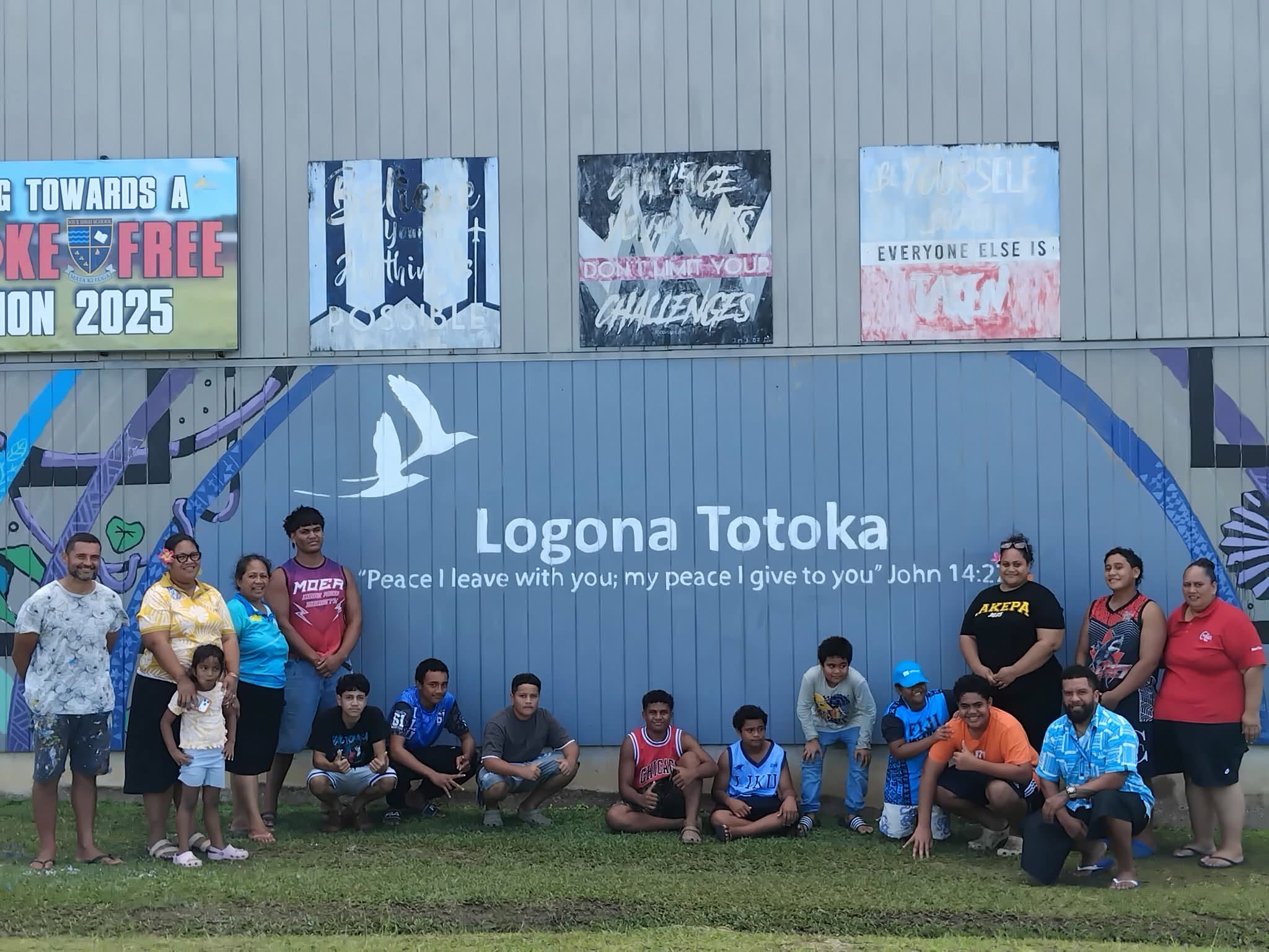 NWA4CJ and community members gathered at the Logona Totoka mural, Niue High School